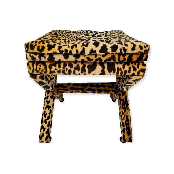 Tufted stool in leopard velvet frabric with upholsteted x base with castors