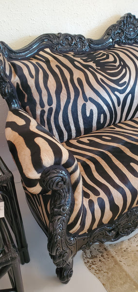 zebra print leather hair on hide fabric on black sofa