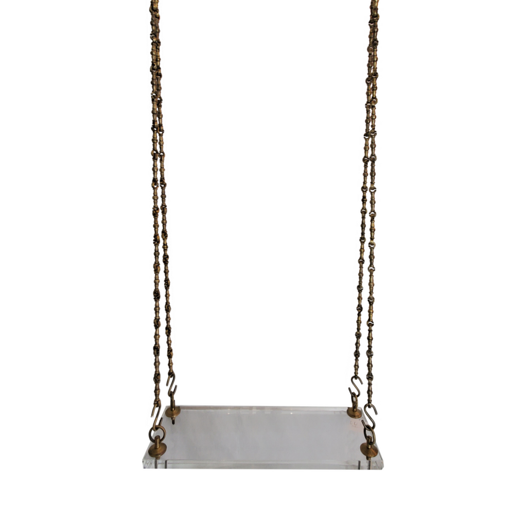 Lucite swing with brass hardware by Luxe Furniture palm beach