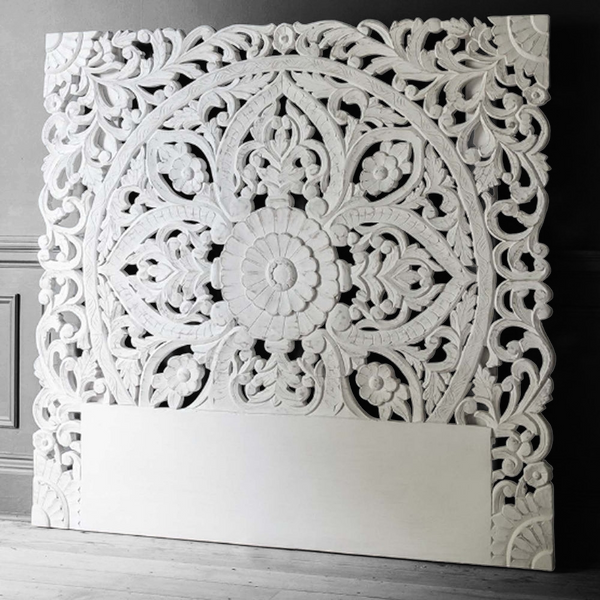 White hand carved wooden headboard