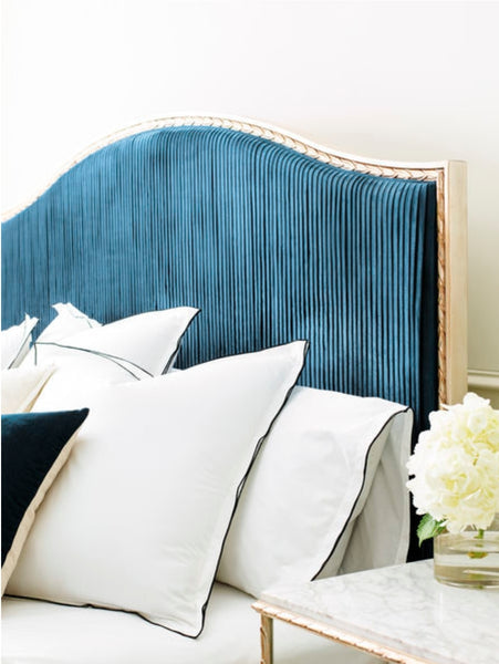 Teal Upholstered headboard with brass frame on the Rococo Bed by Luxe Furniture